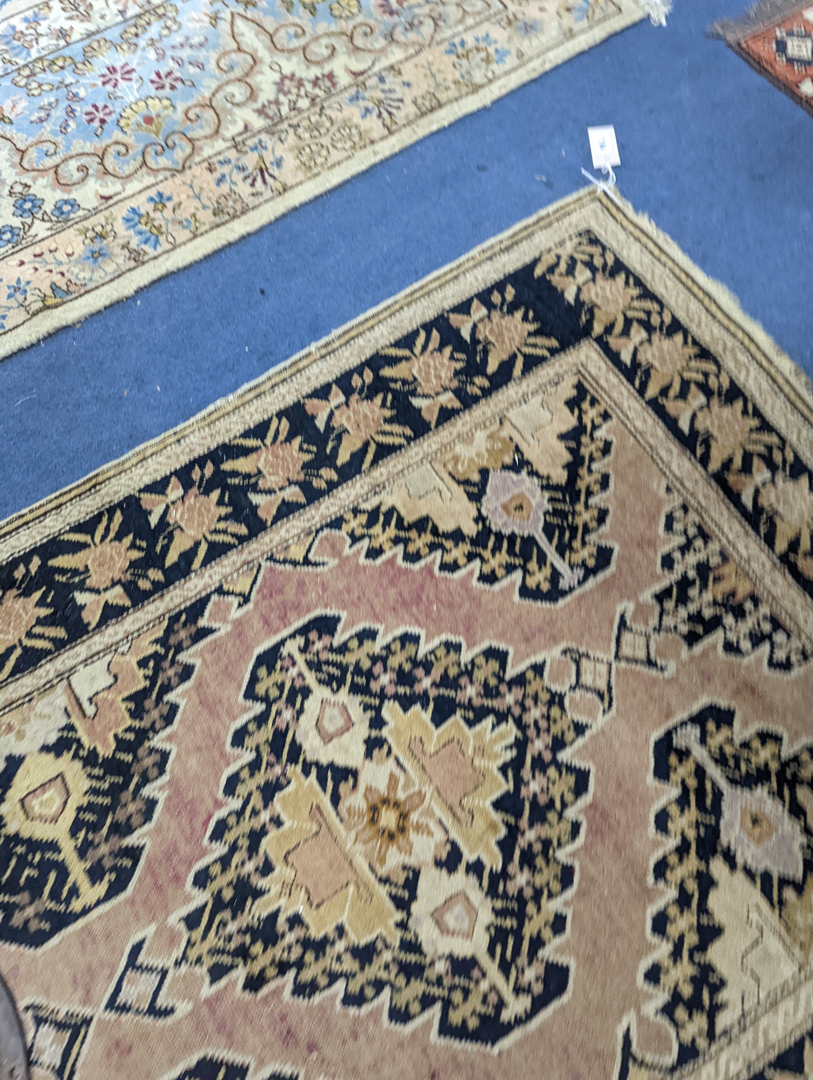 A Caucasian pink ground runner, woven with geometric devices, 483 x 107cm